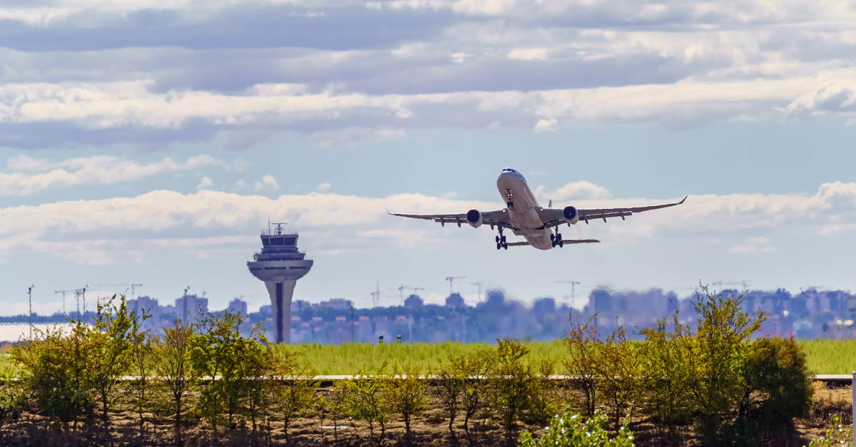 Aircraft taking off at sunset 