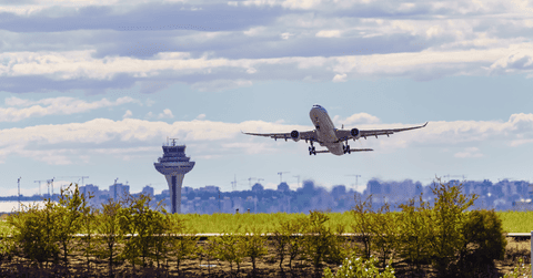 Aircraft taking off at sunset 