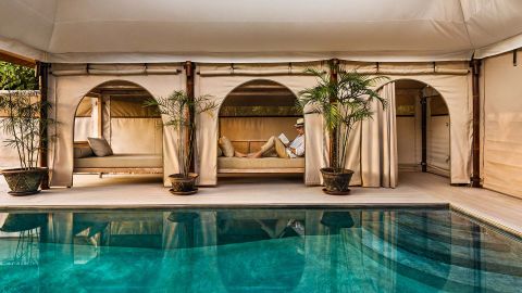 A traveler on holiday at glamping hotel, Bali resort