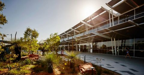 Traveler using self service check in kiost