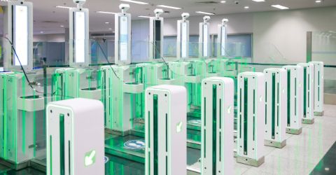 Smiling asian mother and daughter in a modern airport environment