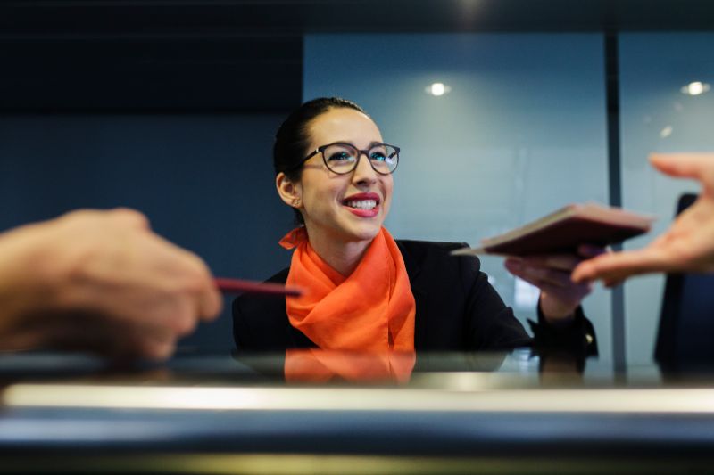 Agent checking in passengers off-airport with ACUS Mobile/