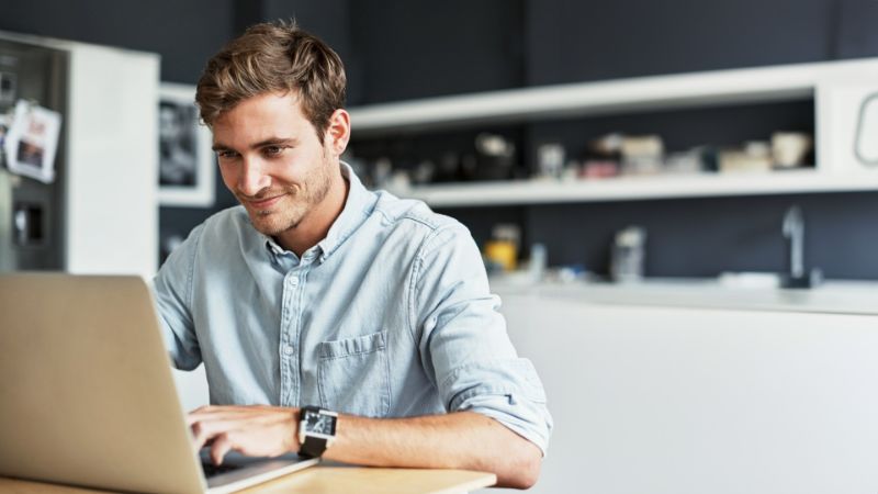 Young professional using Virtual APOC on a laptop computer.