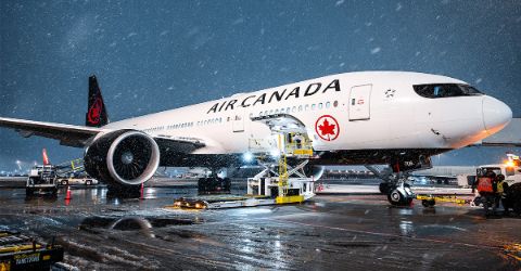 Air Canada branded aircraft at the tarmac in snow