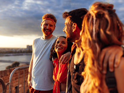 A joyous group of friends who are at a summer music festival