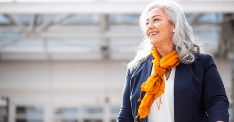 Hispanic smiling woman leaving the airport